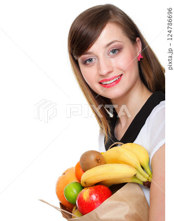 Healthy lifestyle - cheerful woman with fruit shopping paper bag Healthy lifestyle - cheerful woman with fruit shopping paper bag 124786696