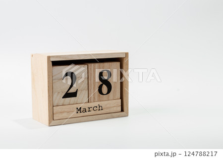 Wooden calendar March 28 on a white background Wooden calendar March 28 on a white background 124788217