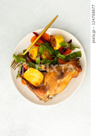 Enjoy a delicious, hearty meal with baked rabbit, roasted potatoes, and carrot salad, combining savory flavors and wholesome ingredients for a nutritious and satisfying dinner Enjoy a delicious, hearty meal with baked rabbit, roasted potatoes, and carrot salad, combining savory flavors and wholesome ingredients for a nutritious and satisfying dinner 124788677