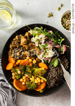 A balanced breakfast bowl with black quinoa, avocado, roast chicken, and sweet potatoes, topped with a fresh cabbage and radish salad A balanced breakfast bowl with black quinoa, avocado, roast chicken, and sweet potatoes, topped with a fresh cabbage and radish salad 124788726