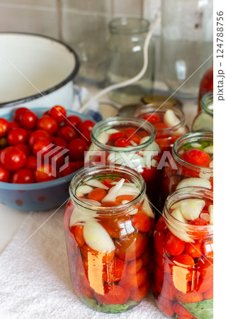 Preserving fresh tomatoes and tomato juice for the winter, stored in airtight jars for long-term use Preserving fresh tomatoes and tomato juice for the winter, stored in airtight jars for long-term use 124788756