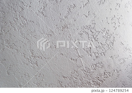 White plastered wall. Uneven background with the texture of decorative plaster painted in white concrete wall. Rough wall with space for copying. High quality photo White plastered wall. Uneven background with the texture of decorative plaster painted in white concrete wall. Rough wall with space for copying. High quality photo 124789254