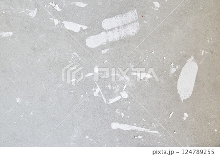 A concrete wall with putty stains. Uneven wall surface with space for copying. High quality photo 124789255