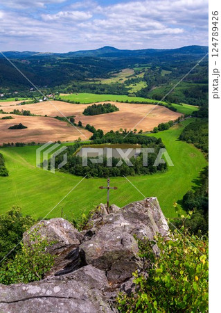 Pond in a beautiful landscape with forests, meadows and fields below Semnicka skala in the protected landscape area Slavkovsky les near Karlovy Vary, Doupovske hory, Czech Republic, sunny summer day 124789426