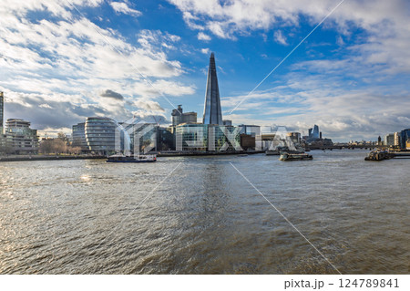 Modern London cityscape with The Shard towering over Thames waterfront 124789841