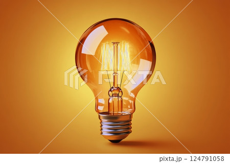 Bright vintage light bulb glowing warmly against an orange background 124791058