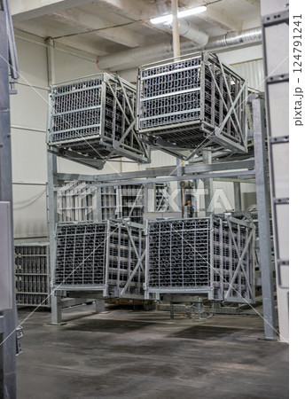 Equipment for turning over bottles of sparkling wine at winery. 124791241