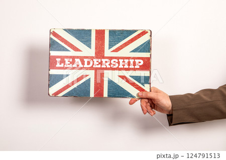 Leadership Concept with Vintage Union Jack Sign Held by Hand Leadership Concept with Vintage Union Jack Sign Held by Hand 124791513