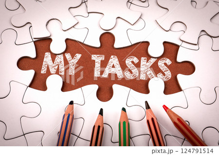 MY TASKS. White puzzle pieces and colored pencils 124791514