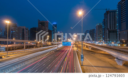Sheikh Zayed road traffic day to night timelapse and Dubai Metro. Dubai, UAE. 124791603
