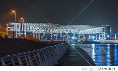 New pedestrian bridge over the Dubai Water Canal illuminated at night timelapse. United Arab Emirates, Middle East New pedestrian bridge over the Dubai Water Canal illuminated at night timelapse. United Arab Emirates, Middle East 124791614