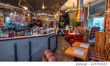 Modern cafe interior with counter and wooden tables with chairs timelapse Modern cafe interior with counter and wooden tables with chairs timelapse 124791633