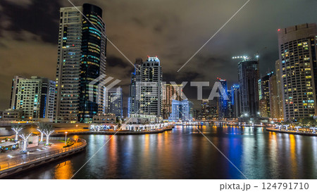 Dubai Marina towers and canal in Dubai night timelapse hyperlapse 124791710