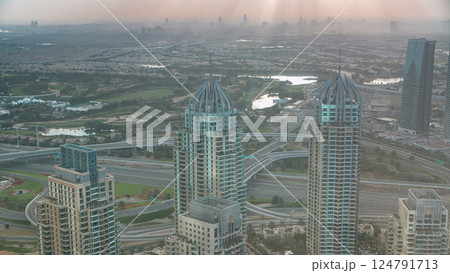 Morning in Dubai Marina with towers and traffic on road from skyscraper, Dubai, UAE timelapse 124791713
