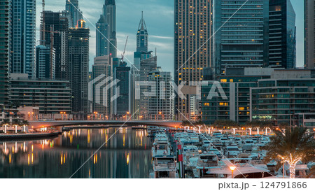 Dubai Marina towers and canal in Dubai night to day timelapse 124791866