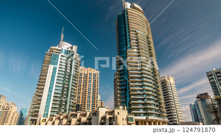 Dubai Marina towers in Dubai at day time timelapse 124791870