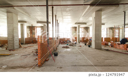 Bricklayers laying bricks to make a walls timelapse. Bricklayers laying bricks to make a walls timelapse. 124791947