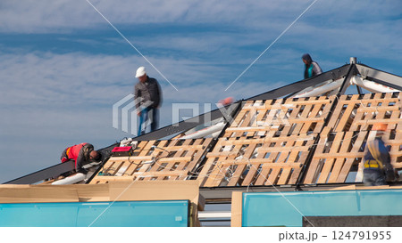 Builders and carpenters working on the roof timelapse Builders and carpenters working on the roof timelapse 124791955