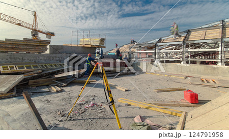 Construction worker using theodolite surveying optical instrument timelapse. Construction worker using theodolite surveying optical instrument timelapse. 124791958