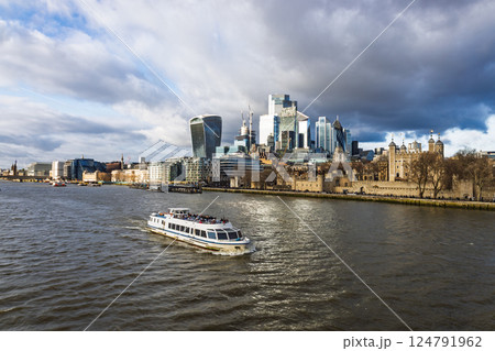 River Thames boat with City of London skyline and Tower of London view 124791962