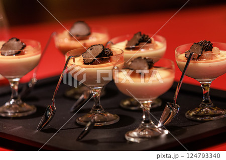 Elegant gourmet dessert served in delicate glassware 124793340