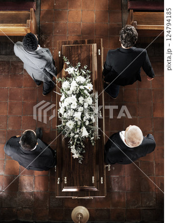 Funeral, family coffin and church above for death, grief or burial service with solidarity. Group, pallbearers and people together with casket for respect, farewell or sad in mourning, mass or loss 124794185