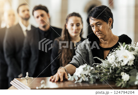 Funeral, death and coffin in church or Christian family gathering together for support. Religion, sad people and mourning loss or religious catholic men and women grief in church service over casket Funeral, death and coffin in church or Christian family gathering together for support. Religion, sad people and mourning loss or religious catholic men and women grief in church service over casket 124794204