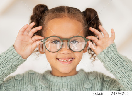 Vision, eye care and portrait of child with glasses for optical healthcare, eyesight support and test prescription eyeglasses. Optometry store, retail choice and happy youth girl trying on lens frame 124794290