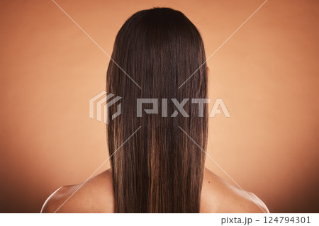 Brunette woman, shine and hair care, beauty salon, balayage and hair dye, color cosmetics and wig extension on studio orange background. Back of head, scalp and long hair style with smooth texture 124794301
