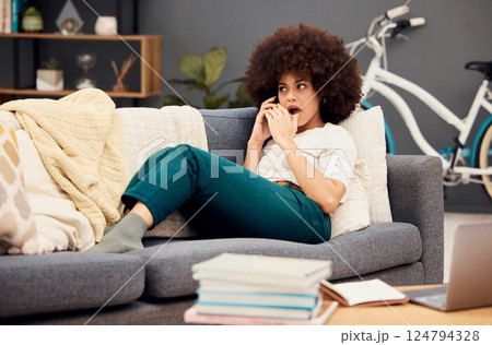 Surprise, phone call and black woman student on sofa with wow for study results, fake news or education feedback scholarship announcement. Girl on lounge and cellphone for shocked sales communication 124794328