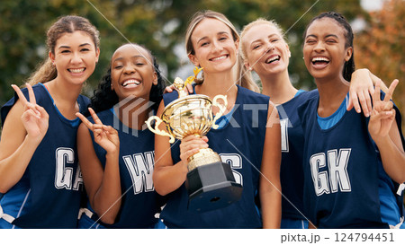 Netball, trophy and winner women with team portrait for success, goal and celebration for competition or game. Happy sports teenager group with motivation, prize and celebrate winning achievement Netball, trophy and winner women with team portrait for success, goal and celebration for competition or game. Happy sports teenager group with motivation, prize and celebrate winning achievement 124794451