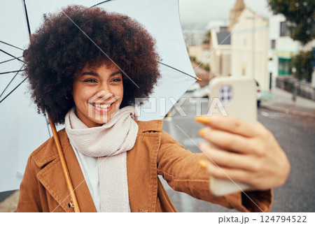 Selfie, smile and woman with a phone and umbrella during winter in the street of Australia. Video call, 5g communication and girl with a mobile photo and live streaming in the street during rain Selfie, smile and woman with a phone and umbrella during winter in the street of Australia. Video call, 5g communication and girl with a mobile photo and live streaming in the street during rain 124794522