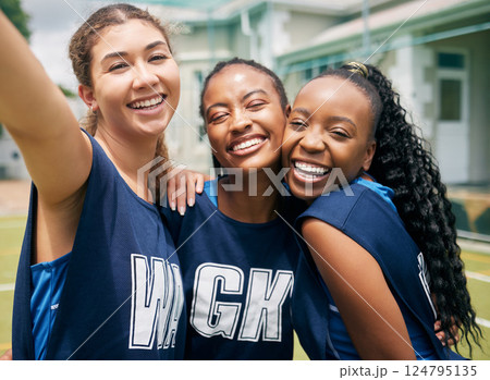 Sports, team and girl netball selfie, hug with fitness and college or school club with outdoor portrait. Exercise, competitive sport and happy people, smile in picture and player training on court. Sports, team and girl netball selfie, hug with fitness and college or school club with outdoor portrait. Exercise, competitive sport and happy people, smile in picture and player training on court. 124795135