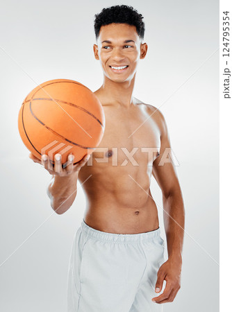 Sports, basketball and man in a fitness studio after training, workout or exercise with a smile on his face. White background, wellness and happy fitness model or basketball player with mockup space Sports, basketball and man in a fitness studio after training, workout or exercise with a smile on his face. White background, wellness and happy fitness model or basketball player with mockup space 124795354