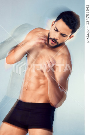 Body, strong and boxing with a man muscular model in studio on a gray background for health or fitness. Sports, muscle and training with a male athlete or boxer punching during an exercise workout Body, strong and boxing with a man muscular model in studio on a gray background for health or fitness. Sports, muscle and training with a male athlete or boxer punching during an exercise workout 124795643
