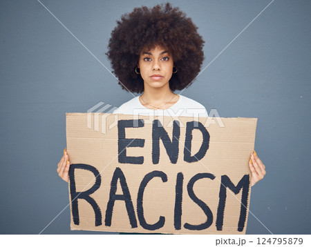 Portrait of black woman, end racism and protest banner for activism, freedom support or racial independence. African american person, protesting board and proud diversity in grey background studio 124795879