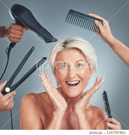 Hair care, excited and senior woman with hairdresser for beauty, haircut and preparation on grey studio background. Happy, smile and surprise face of an elderly model with hands of stylist for hair Hair care, excited and senior woman with hairdresser for beauty, haircut and preparation on grey studio background. Happy, smile and surprise face of an elderly model with hands of stylist for hair 124795962