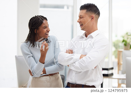 Diversity, office and work friends in conversation, talking and laughing together on break. Communication, friendship and happiness in the workplace with black woman and man chat, speaking and joke Diversity, office and work friends in conversation, talking and laughing together on break. Communication, friendship and happiness in the workplace with black woman and man chat, speaking and joke 124795975