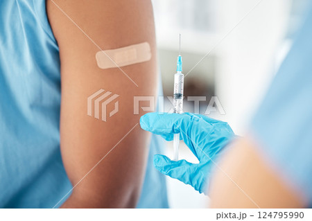 Doctor hands, covid vaccine or band aid on arm after global virus injection in security, safety or wellness life insurance. Zoom, medical nurse or healthcare worker and plaster for hospital black man Doctor hands, covid vaccine or band aid on arm after global virus injection in security, safety or wellness life insurance. Zoom, medical nurse or healthcare worker and plaster for hospital black man 124795990