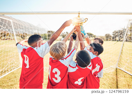 Children, winner and team soccer with trophy celebrating victory, achievement or match on the field. Kids in celebration for teamwork, sports and football match or game win together in the outdoors Children, winner and team soccer with trophy celebrating victory, achievement or match on the field. Kids in celebration for teamwork, sports and football match or game win together in the outdoors 124796159