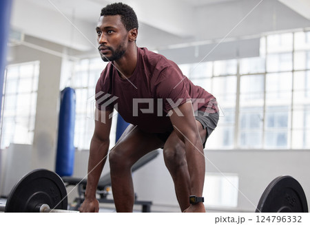 Weightlifting, fitness and man at gym for training, health and exercise, energy and bodybuilding. Bodybuilder, weights and black man with strong mindset focused on cardio, biceps and body workout 124796332