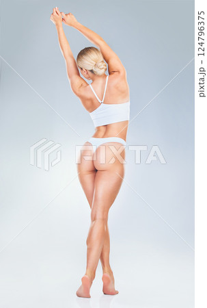 Beauty, woman and body wellness lingerie for nutrition diet, hair removal or liposuction product advertising. Back view of model girl with gray studio mock up for health or cosmetic marketing. 124796375