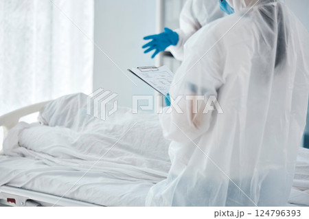 Death, covid and doctors writing paper for patient in a bed at a hospital due to virus. Healthcare, medical and clinic workers with communication, report and help during health crisis in pandemic Death, covid and doctors writing paper for patient in a bed at a hospital due to virus. Healthcare, medical and clinic workers with communication, report and help during health crisis in pandemic 124796393