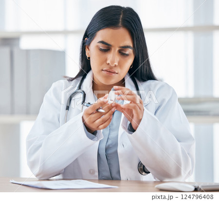 Woman with medication prescription, health and doctor in hospital office, focus and reading instruction label. Healthcare, stethoscope and medical paperwork on desk, vaccine or cold and flu medicine. Woman with medication prescription, health and doctor in hospital office, focus and reading instruction label. Healthcare, stethoscope and medical paperwork on desk, vaccine or cold and flu medicine. 124796408