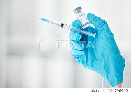 Covid, vaccine and medicine with hands of doctor and syringe for science, pharmacy and medical. Virus, flu and disease with healthcare worker and injection for immunity, treatment and prevention Covid, vaccine and medicine with hands of doctor and syringe for science, pharmacy and medical. Virus, flu and disease with healthcare worker and injection for immunity, treatment and prevention 124796446