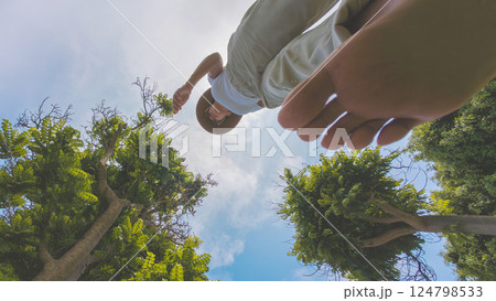 Young woman walking barefoot in nature on walk barefoot day 124798533