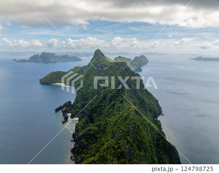 Tropical beaches in Matinloc Island. Blue sky and clouds. El Nido, Philippines. Tropical beaches in Matinloc Island. Blue sky and clouds. El Nido, Philippines. 124798725
