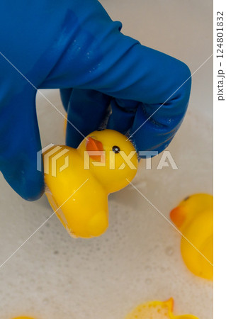 a composition of yellow rubber ducks demonstrating the need for hygienic toy handling a composition of yellow rubber ducks demonstrating the need for hygienic toy handling 124801832