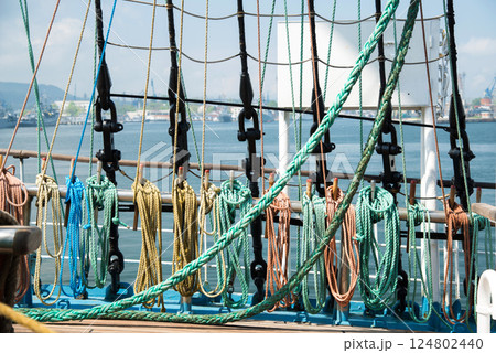 Marine equipment on the deck of a ship. Marine ropes and different tackles. 124802440