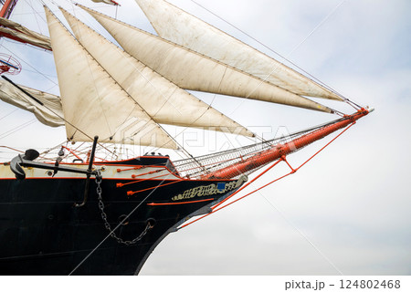 Old-fashioned sailing regatta with stretched sails - detail. Copy space. 124802468
